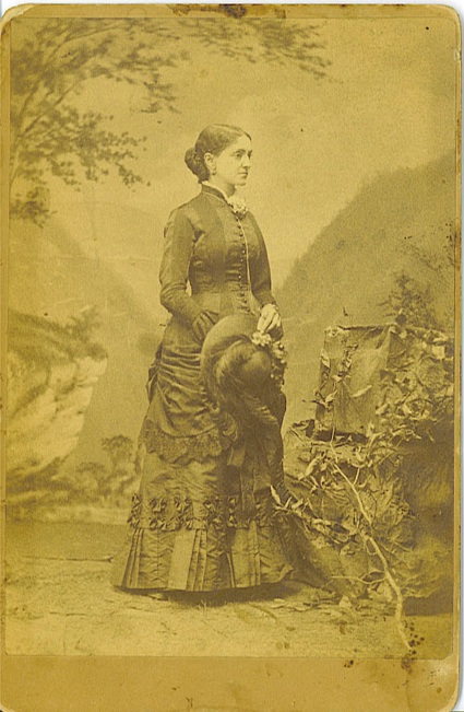 Cabinet card circa 1880s showing a distinguished looking standing African American woman holding a hat.