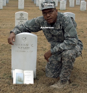 Charles Anderson in modern United States Army uniform, kneeling at the government issued headstone of Buffalo Solder William C. Nesbit, in Fort Sam Houston Cemetery.