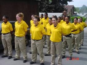 Oblique angle photograph of young cadets lined up in parade formation.