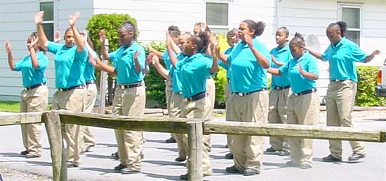 Vision Quest Buffalo Soldiers step drill team begin a routine.