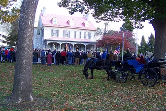 View of assembled crowd at Harris-Cameron mansion.