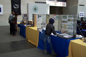 Attendees viewing the history exhibits during event.