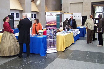 Attendees viewing the history exhibits during the event.