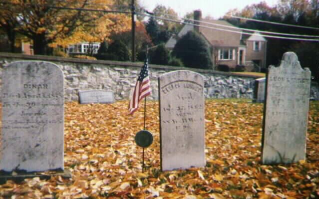 Photo showing three tombstones of slaves, front view.
